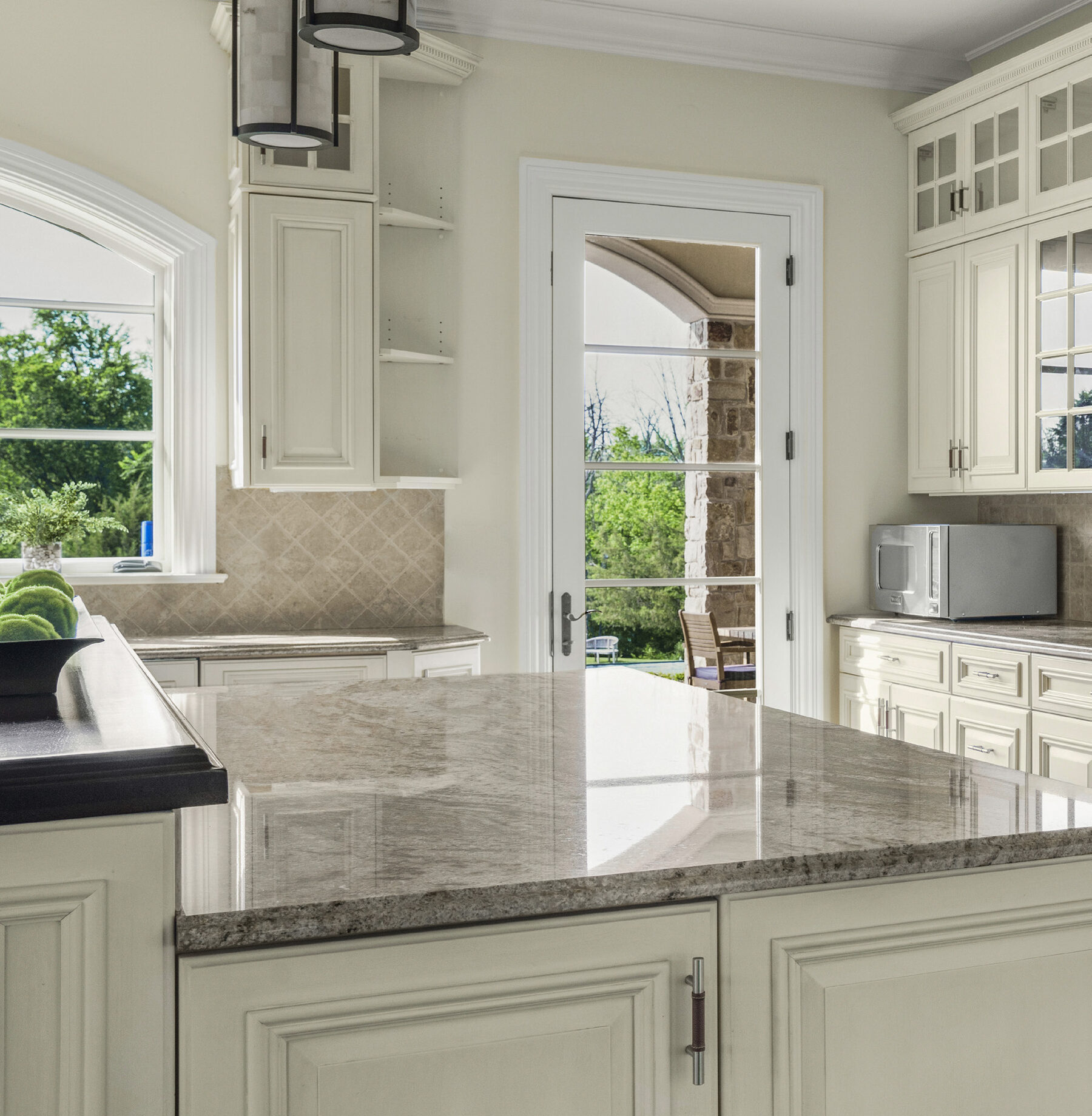 center island with seating for four in the kitchen at The Princeton Preserve
