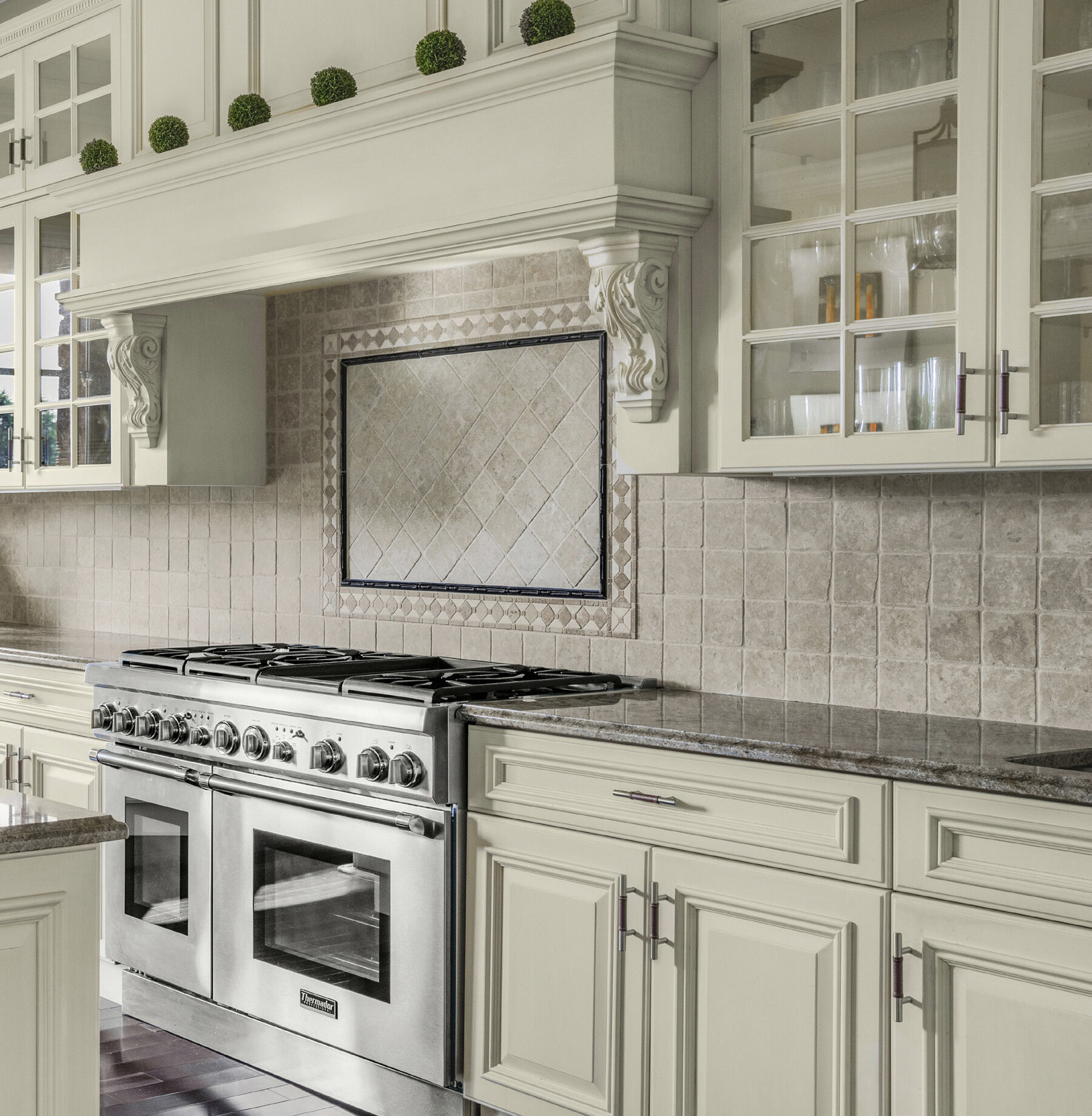 range and custom hood detail in the kitchen at The Princeton Preserve