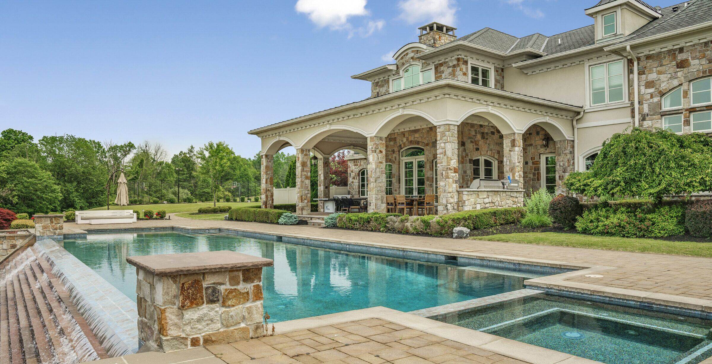 heated in-ground pool and stone terraces at The Princeton Preserve